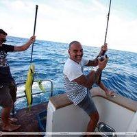 Christian Audigier catches a huge fish with his girlfriend Nathalie Sorensen | Picture 124254